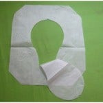 Sanitor Mfg Co. began producing toilet seat covers and dispensers in the USA in 1931.  Seems they are working as your handbag and your barbeque may both harbor more germs than a toilet seat. 